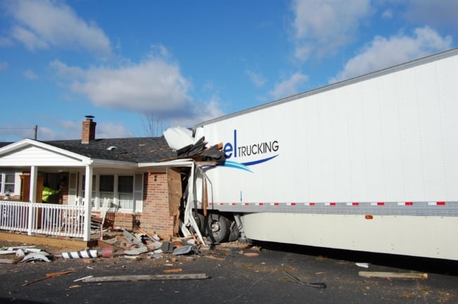 Tractor-trailer crashes into house in Carroll County, driver killed