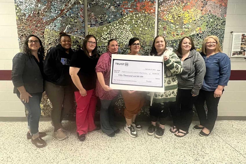 L to R: Stephanie Addikis (NRCC adult career coach and community outreach specialist), Myasia Hendricks (NRCC student), Myasia Hendricks (NRCC student), Sierra Fiore (NRCC student), Courtney Redman (NRCC student), Samantha Scott (NRCC student), Sarah Woodyard (NRCC student), Kelly Litchford (NRCC student), Dr. Dee Dee Kennedy (NRCC dean of student services)